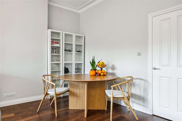 This beautifully designed, spacious two-bedroom period conversion offers over 1,000 sq. ft. of elegant living space on the ground floor of a charming property. - Photo 1