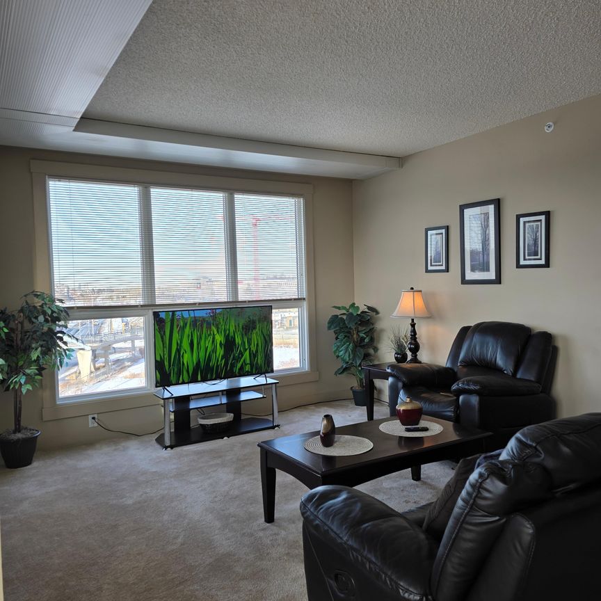 Experience urban elegance in this modern, FULLY FURNISHED, ALL-INCLUSIVE, executive 2-bedroom, 2-bathroom condo. - Photo 1