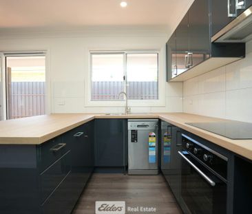 Convenient 2-Bedroom Unit with Low Maintenance - Photo 2