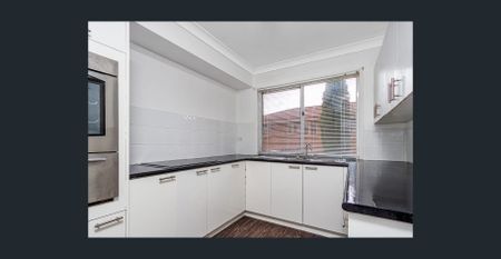 CONVENIENTLY LOCATED TOWNHOUSE - Photo 2