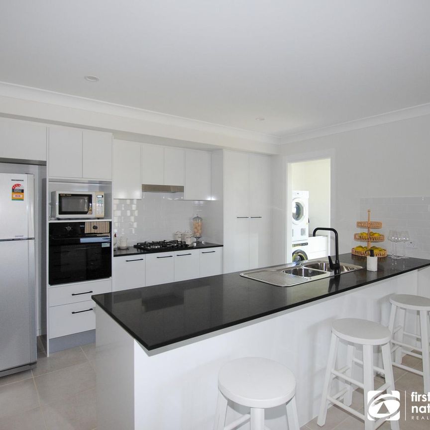 Modern, Fully Furnished Family Home with Space, Style & Comfort - Photo 1