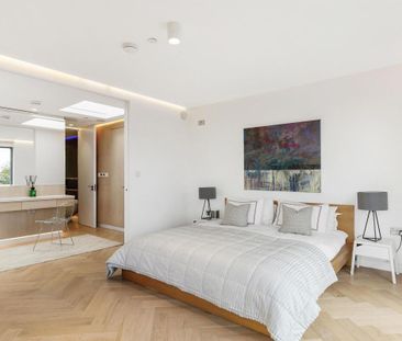 Introducing a remarkable dwelling nestled within a serene woodland enclave, the epitome of contemporary architecture. - Photo 2