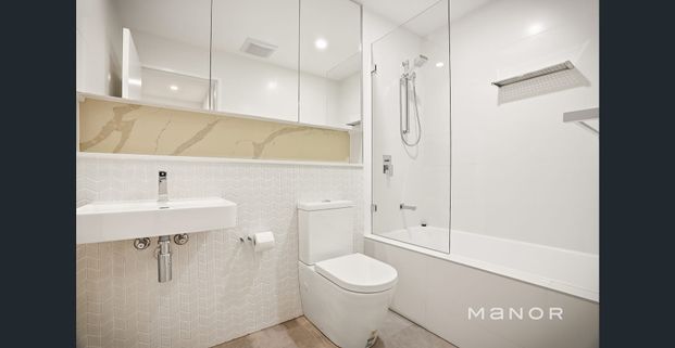 LUXURY UNIT WITH 2ND BEDROOM OR STUDY - Photo 1