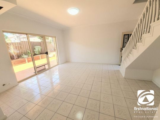 BEAUTIFULLY PRESENTED TOWNHOUSE WITH DOUBLE LOCK-UP GARAGE - Photo 1