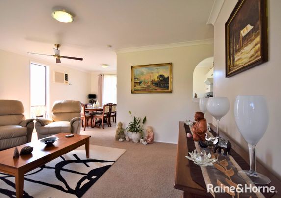 Neat and Inviting Home with Enclosed Carport - Photo 1