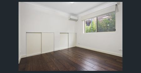 AFFORDABLE TWO BEDROOM EXECUTIVE LIVING IN THE CONVENIENT LOCATION - Photo 2