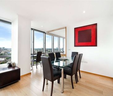 An interior designed 2 bedroom apartment situated on the 26th floor of this striking development located close to heart of Canary Wharf's Business district. - Photo 1