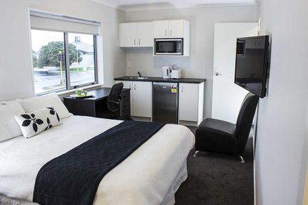 This is a modern, fully furnished studio unit. - Photo 3