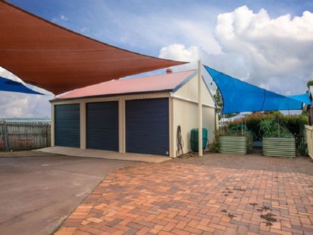 The Whole Package! Spacious 5-Bedroom Home + Sheds Galore! - Photo 4