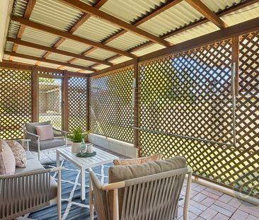 Charming Lowset Brick Home with Large Backyard & Versatile Living - Photo 1