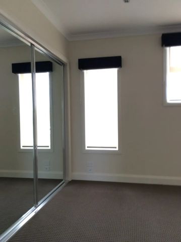 Register to Inspect // Stylish Two-Bedroom Townhouse with Dual Living Spaces - Photo 2