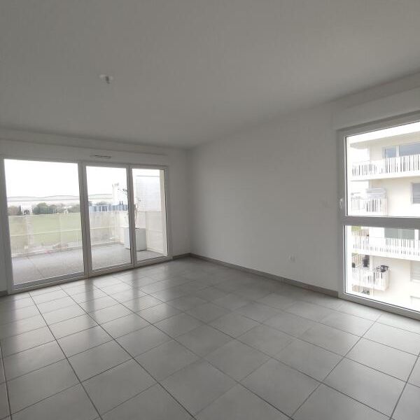 Location Appartement 3 pièces 64m² BEAUZELLE 31700 - Photo 1