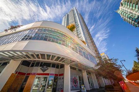 2 Bed Condo | Surrey University District | Parking • Den - Photo 3