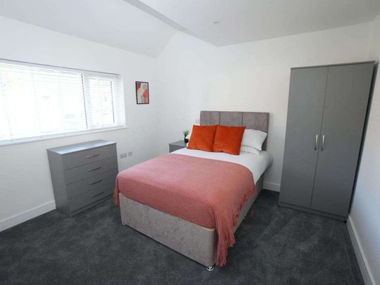 50% Off First Month | Steps From QA Hospital Room 5 - Photo 1