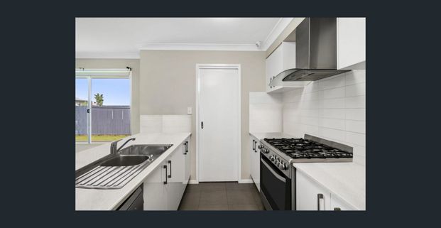 Beautiful 4-Bedroom Family Home in Highly Sought-After Springfield Lakes! - Photo 1