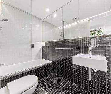DEPOSIT TAKEN - Oversized Designer 2-Bedroom Apartment Bathed in Na... - Photo 2