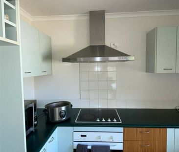 WELL PRESENTED BRICK AND TILE HOME - Photo 4