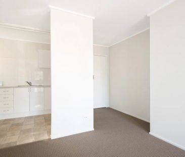 Well-Located Two-Bedroom Apartment with Carport - Photo 4