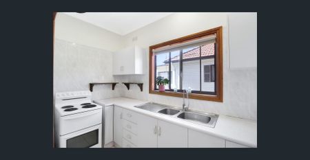 Charming Port Kembla Home with Spacious Living and Expansive Yard - Photo 3