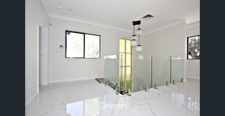 Stylish Four-Bedroom Home in Prime Location! - Photo 3