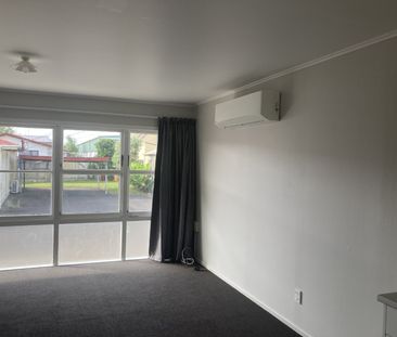 This generous two-bedroom unit offers an open-plan living area, two... - Photo 3