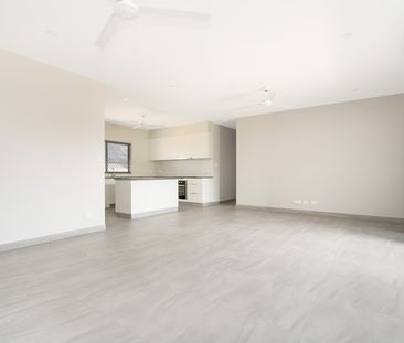 STYLISH FAMILY HOME ON A PRIVATE CORNER BLOCK! - Photo 1