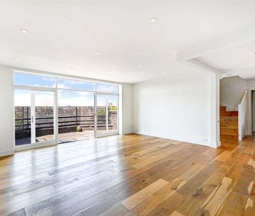 A spectacular duplex penthouse apartment with two incredible roof terraces on the fourth and fifth floors of this period conversion with lift access and access to the communal gardens. - Photo 1