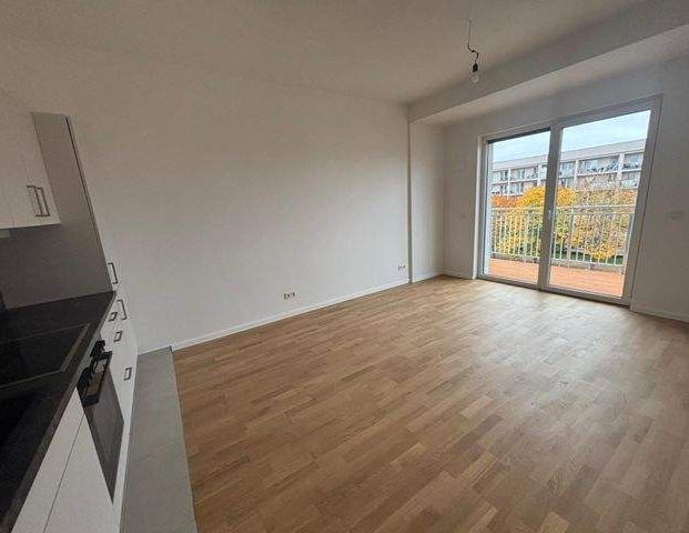 Wohnung mit EB- Küche - Erstbezug, Balkon u. Fußbodenheizung - Foto 1