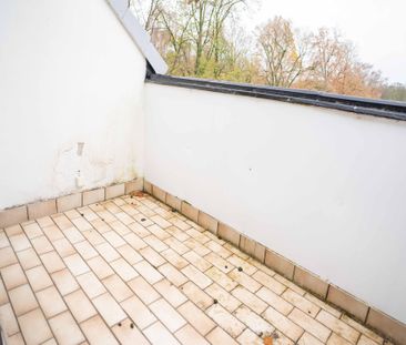 Direkt am Schmölderpark: Schickes DG-Appartement mit Einbauküche! - Photo 1