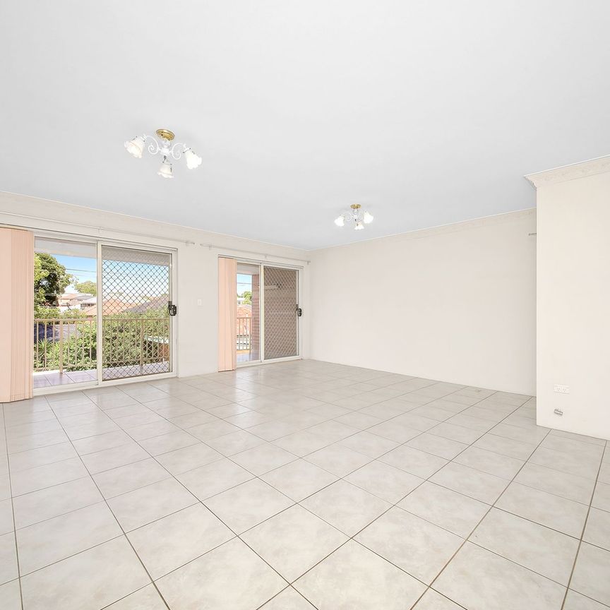 UPDATED MODERN UNIT IN POPULAR SECURITY COMPLEX - Photo 1