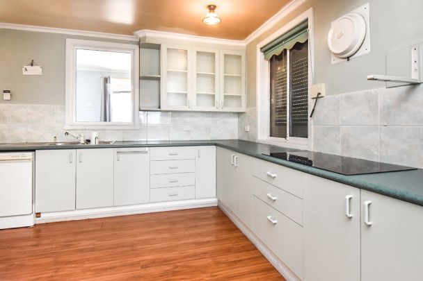 Three-Bedroom Home with Secure Yard - Photo 1