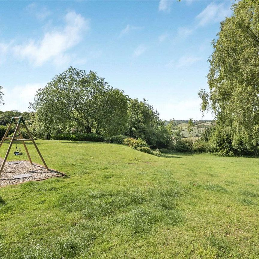 A comfortable and stylish five bedroom family home with wonderful views over the Stonor Valley, offering a maintained garden and is situated within close proximity of Henley-on-Thames. - Photo 1
