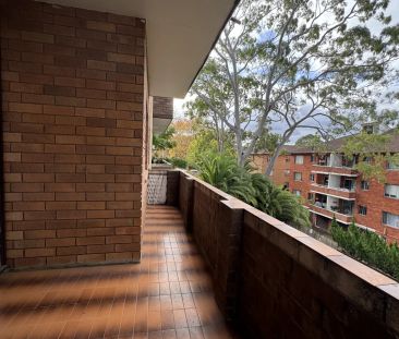 Spacious 2 Bedroom Unit with Garage in Convenient Location - Photo 1