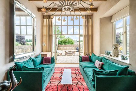 A stunning Grade II-listed barn conversion with beautifully imagined, high specification interiors, in the heart of an idyllic Cotswolds village - Photo 3