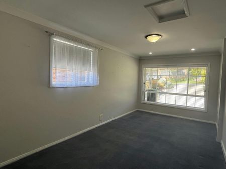 Bright Family Home with Sunroom and Outdoor Living Space - Photo 3