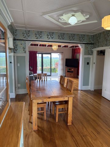 Step inside this beautifully presented 1930s three-bedroom, one-bathroom home, full of character and warmth. - Photo 2