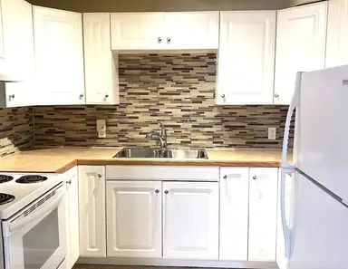 NEWER RENOD LEGAL 2BR Bsmt -Newer Kitchen,hardwood,windows,great layout-Pets ok | 6030 Martingrove Road NE, Calgary - Photo 1