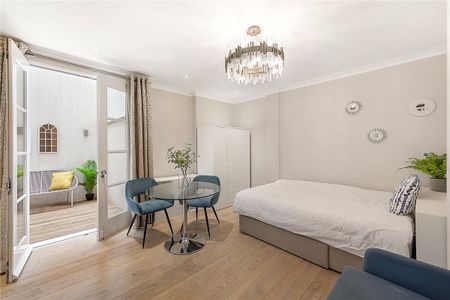 An exceptional, immaculate studio of 383 sq ft with private decked patio situated on the lower ground floor of this beautifully maintained period residential building. EPC rating: C - Photo 4