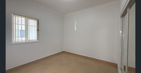 Spacious 4-Bedroom Home with Separate Retreat - Photo 2