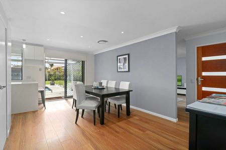 IMPRESSIVE 4 BEDROOM HOME WITH DOUBLE GARAGE AND INGROUND SWIMMING POOL - Photo 3