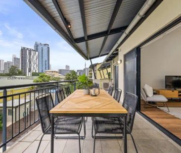 “Outstanding Top Floor Furnished Apartment with City Views!” - Photo 3