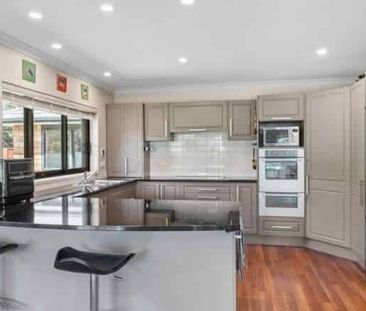 Spacious Four-Bedroom Home with Multiple Living Areas and Private G... - Photo 3