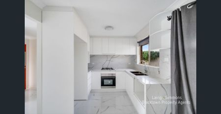 MODERN RENOVATED THREE BEDROOM HOME! - Photo 3