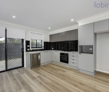 Brand new three bedroom townhouse with ducted air conditioning - Photo 4