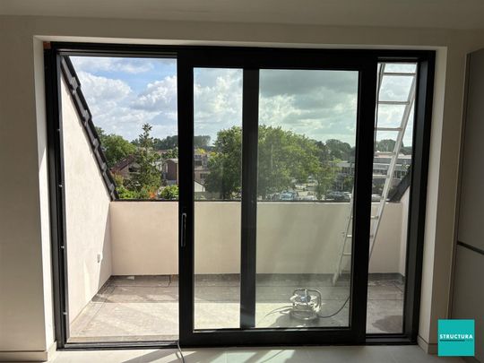 Appartement met 2 slaapkamers en 2 staanplaatsen in centrum Merchtem - Photo 1