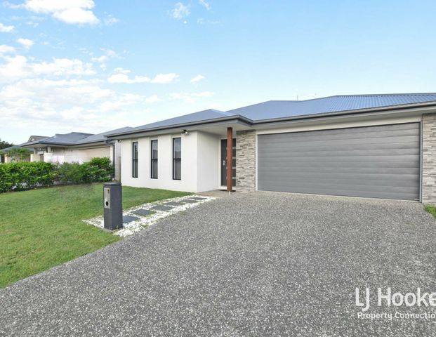 MODERN FAMILY HOME WITH MULTIPLE LIVING AREAS! - Photo 1