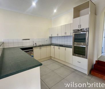 Modern 4-Bedroom Family Home with Internet & Water Included In Cent... - Photo 2