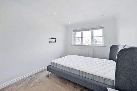 A bright and modern two bedroom first floor apartment with resident parking. - Photo 4