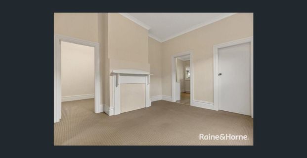Spacious & Versatile Three-Bedroom Home in Prime Location - Photo 1