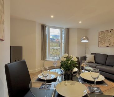 Fully furnished one-bedroom apartment on Hooper Street offers a cos... - Photo 6